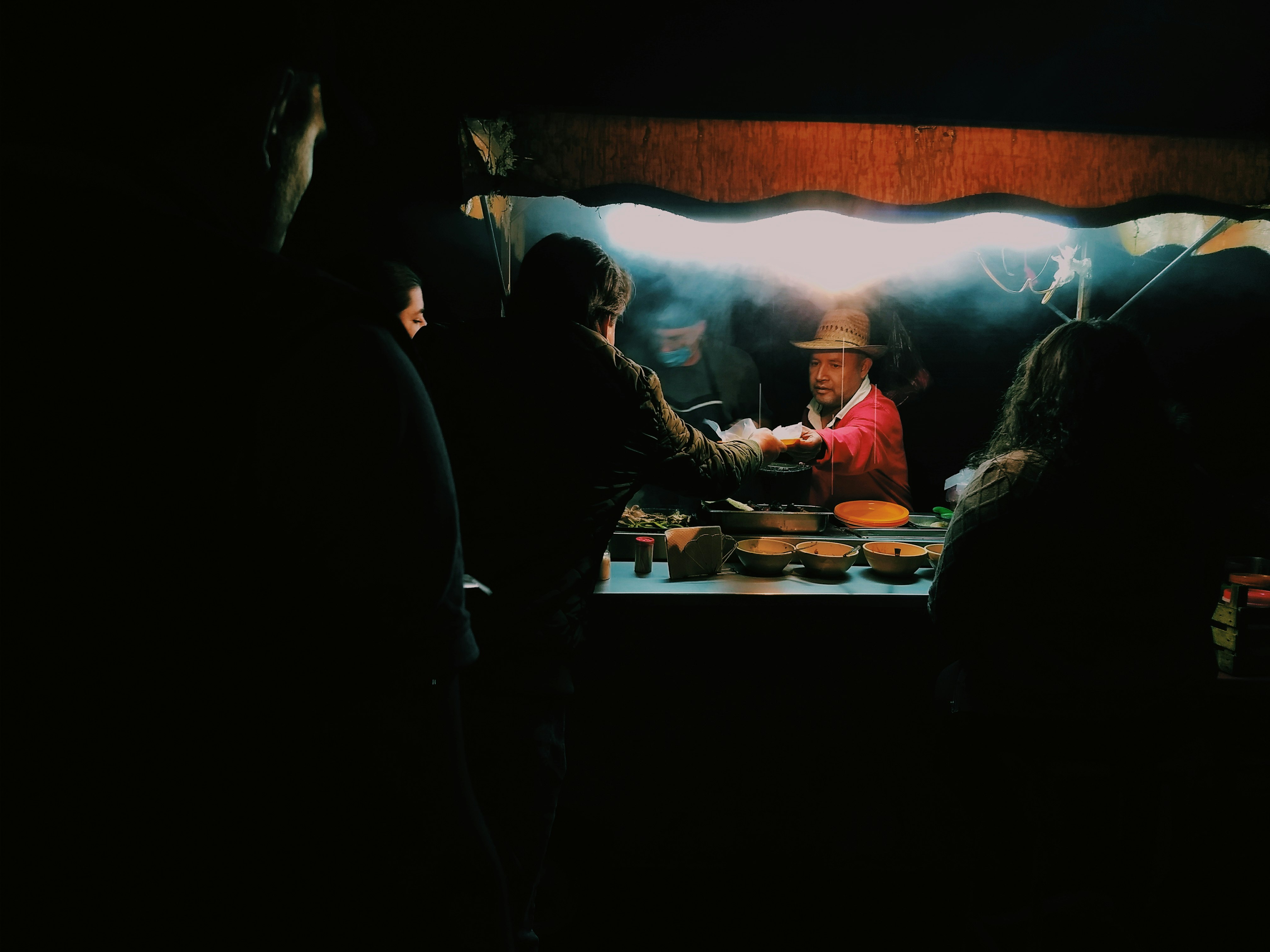 people sitting on chair in front of table